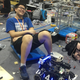A student takes a break from fine-tuning a robot.